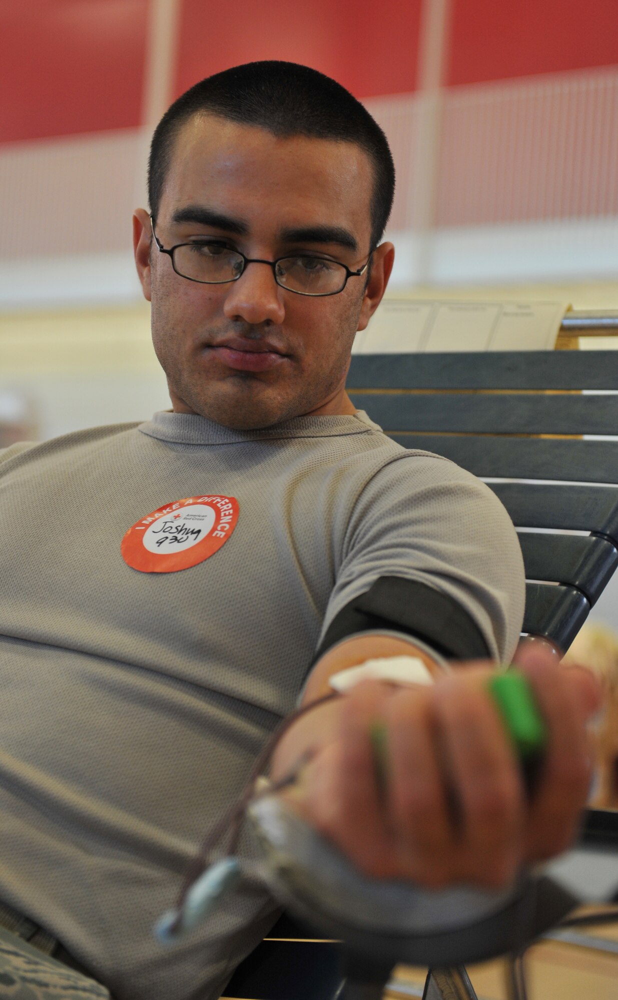 Senior Airman Joshua Sosa, 509th Communication Squadron Radio Frequency Transmission technician, squeezes a rubber ball during a Military Appreciation Blood Drive at the University of Central Missouri, Warrensburg, Mo., Nov. 9. The UCM Office of Military and Veteran Services, the Student Veterans Organization, ROTC Fighting Mules, and Volunteer Services at UCM worked with the American Red Cross to sponsor the blood drive in honor of Veterans Day. (U.S. Air Force photo/Heidi Hunt) (Released)