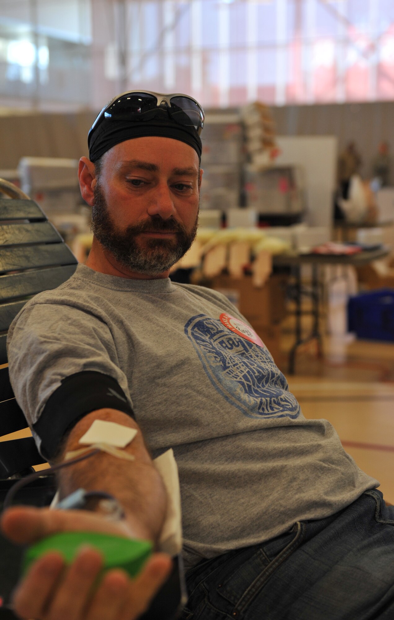 Retired Master Sgt. Ronald Davis, squeezes a ball to keep his blood flowing during a Military Appreciation Blood Drive at the University of Central Missouri, Warrensburg, Mo., Nov. 9. UCM's Office of Military and Veteran Services worked with the American Red Cross to sponsor the blood drive in honor of Veterans Day. Eighty-eight units were collected. (U.S. Air Force photo/Heidi Hunt) (Released)