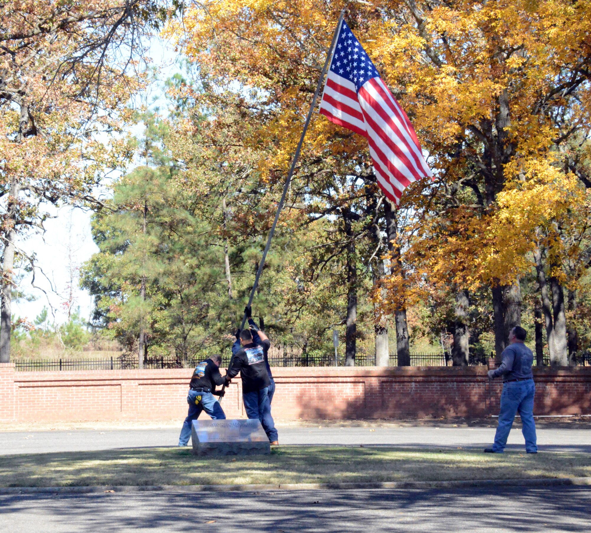 In observance of this year’s Veterans Day, several members of the Robins Riders Motorcycle Group, from on and off base, traveled to Andersonville National Cemetery where they set up 100 flags. (U. S. Air Force photo/Ed Aspera)