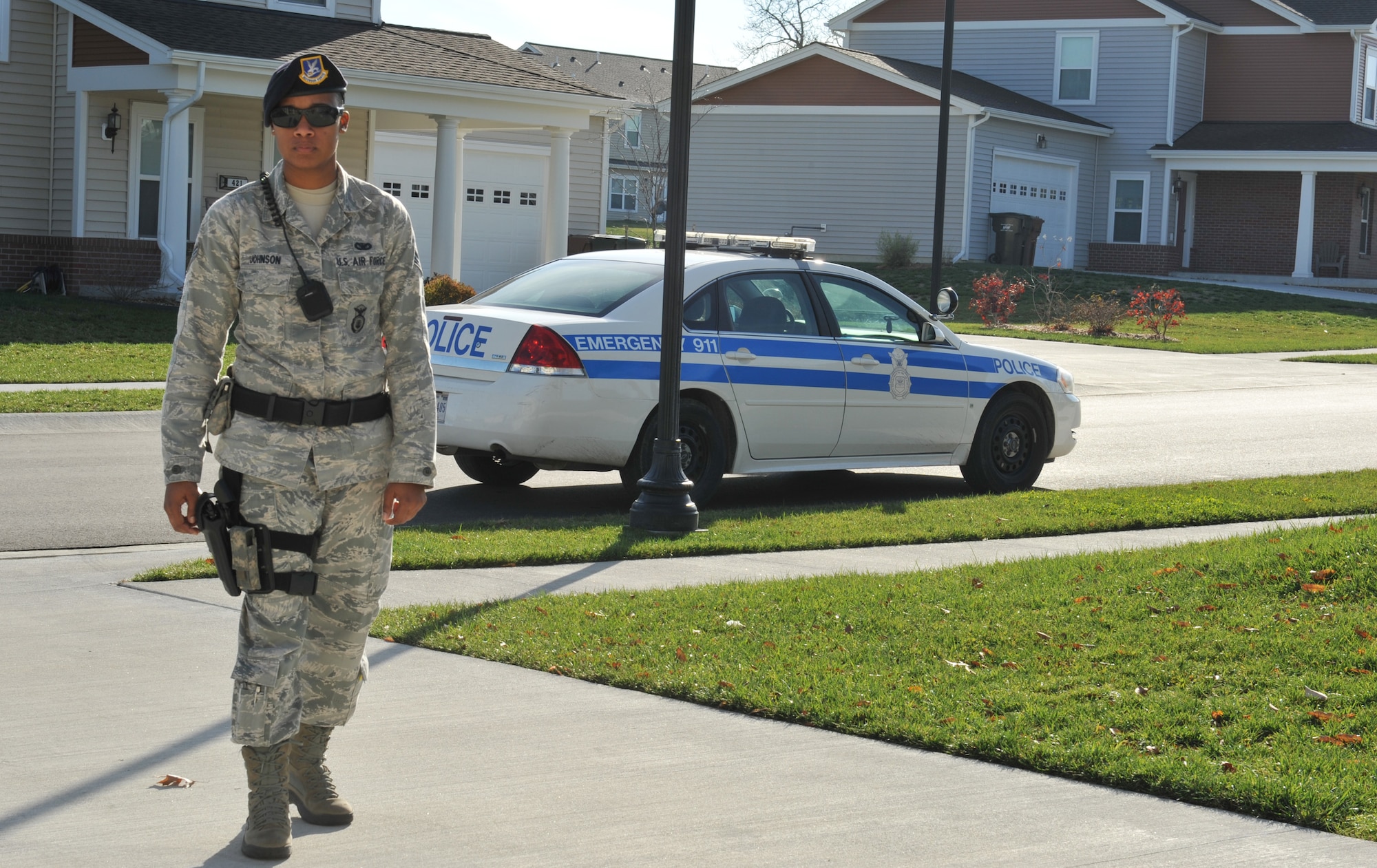Senior Airman Keena Johnson, 509th Security Forces Squadron Law Enforcement, prepares to check a base resident's home as part of Operation Quarters Watch, at Whiteman Air Force Base Nov. 13. Under the Operation Quarters Watch program, the 509th Security Forces Squadron will conduct a physical house check and contact residents if they notice anything out of the ordinary. (U.S. Air Force photo/Heidi Hunt) (Released) 