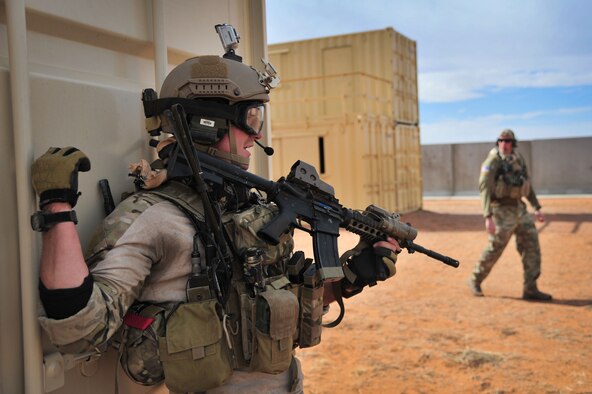 A U.S. Air Force service member gives fellow troops commands during an exercise scenario at Melrose Air Force Range, N.M., Nov. 8, 2012. Special Operations Forces utilize the range's rough terrain and unique layout to conduct realistic training. (U.S. Air Force photo/Airman 1st Class Alexxis Pons Abascal)  