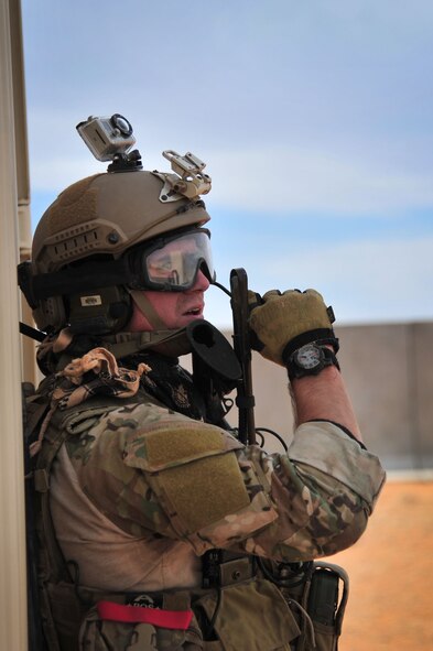 A U.S. Air Force service member communicates with fellow troops during an exercise scenario at Melrose Air Force Range, N.M., Nov. 8, 2012. Special Operations Forces utilize the range's rough terrain and unique layout to conduct realistic training. (U.S. Air Force photo/Airman 1st Class Alexxis Pons Abascal)  