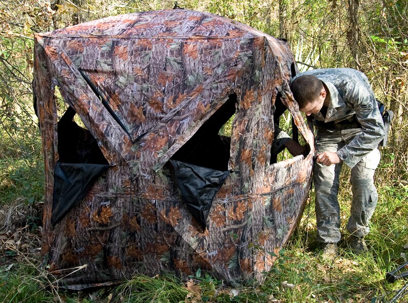 Airman 1st Class Michael Meserole, 2nd Security Forces Squadron game warden, confiscates a blind on the East Reservation of Barksdale Air Force Base, La., Nov. 14. Blinds are confiscated if they are not properly registered and marked. (U.S. Air Force photo/Staff Sgt. Chad Warren)(RELEASED)