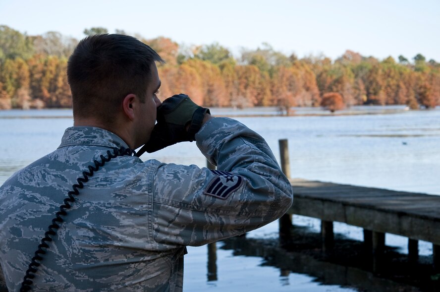 Staff Sgt. David Wales, 2nd Security Forces Squadron game warden NCO in charge, answers a call on his radio while on patrol on Barksdale Air Force Base, La., Nov. 14. The game wardens are responsible for 18,000 acres of forest and wetland that make up the East Reservation. (U.S. Air Force photo/Staff Sgt. Chad Warren)(RELEASED)