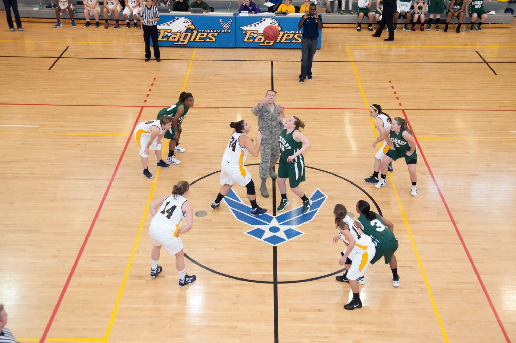 HANSCOM AIR FORCE BASE, Mass. – 2nd Lt. Daniel Langston, 66th Force Support Squadron executive officer, throws up the ceremonial jump ball to begin a women’s college basketball game at the Hanscom Fitness and Sports Center Nov. 10. The matchup between Newbury College and Simmons College was played to provide personnel an opportunity to watch local college basketball on base. (U.S. Air Force photo by Rick Berry)