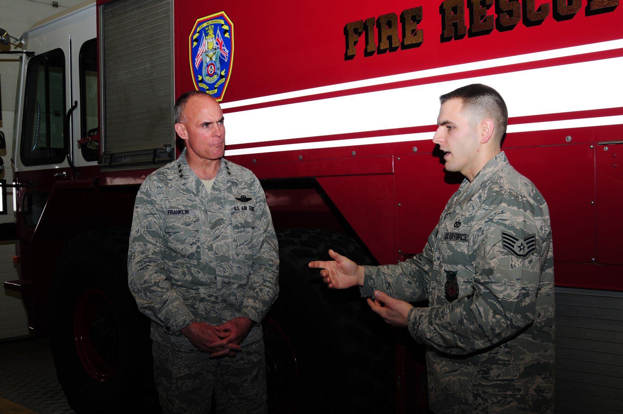 Staff Sgt. David Ordway, 100th Civil Engineer Squadron firefighter, briefs Lt. Gen. Craig A. Franklin, 3rd Air Force commander, Ramstein Air Base, Germany, on the role and responsibilities of the fire department Nov. 15, 2012, at RAF Mildenhall, England. The general expressed how impressed he was with the fire station, trucks and the firefighters’ fitness program. His visit included tours of the 100th Logistics Readiness Squadron Fuels Processing, 100th Maintenance Group Sheet Metal, 100th Operations Group and a static display of a KC-135 Stratotanker. While in England, the general also visited RAF Fairford, RAF Croughton, RAF Welford, RAF Lakenheath and the Cambridge American Cemetery at Madingley. (U.S. Air Force photo by Karen Abeyasekere/Released)