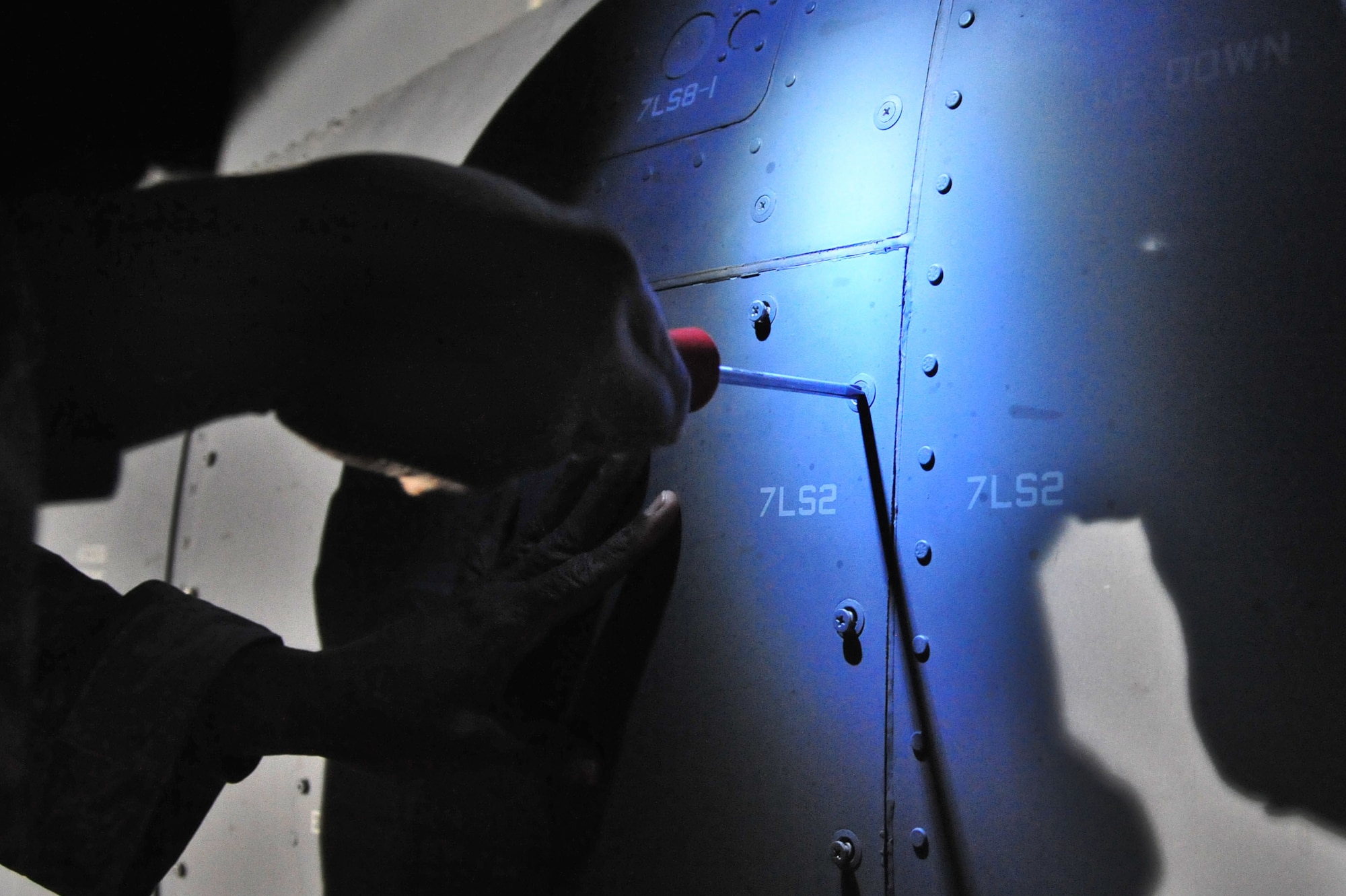 U.S. Air Force Staff Sgt. Charles Phillips, 727th Special Operations Aircraft Maintenance Squadron, removes screws from an air filter housing compartment on a CV-22 Osprey on the flightline at Cannon Air Force Base, N.M., Nov. 2, 2012. The $80 million aircraft relies on routine austere inspections and preventative maintenance for proper functionality as well as Air Force Special Operations Command compliance. (U.S. Air Force photo/Airman 1st Class Alexxis Pons Abascal)  