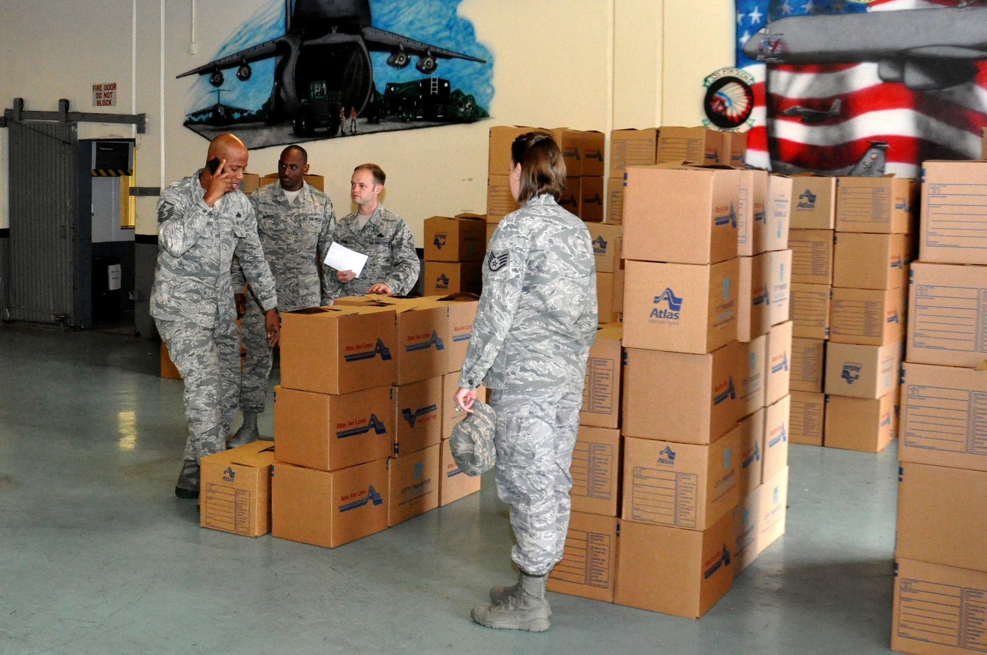 First Sergeants separate food baskets into their respective squadrons at the 4th Logistic Readiness Squadron Dock 1 on Seymour Johnson Air Force Base, N.C., Nov. 14, 2012. The First Sergeant Council asked base personnel for donations for the food baskets to give to Airmen with families or families with a deployed love one. (U.S. Air Force photo/Airman 1st Class Mariah Tolbert/Released)