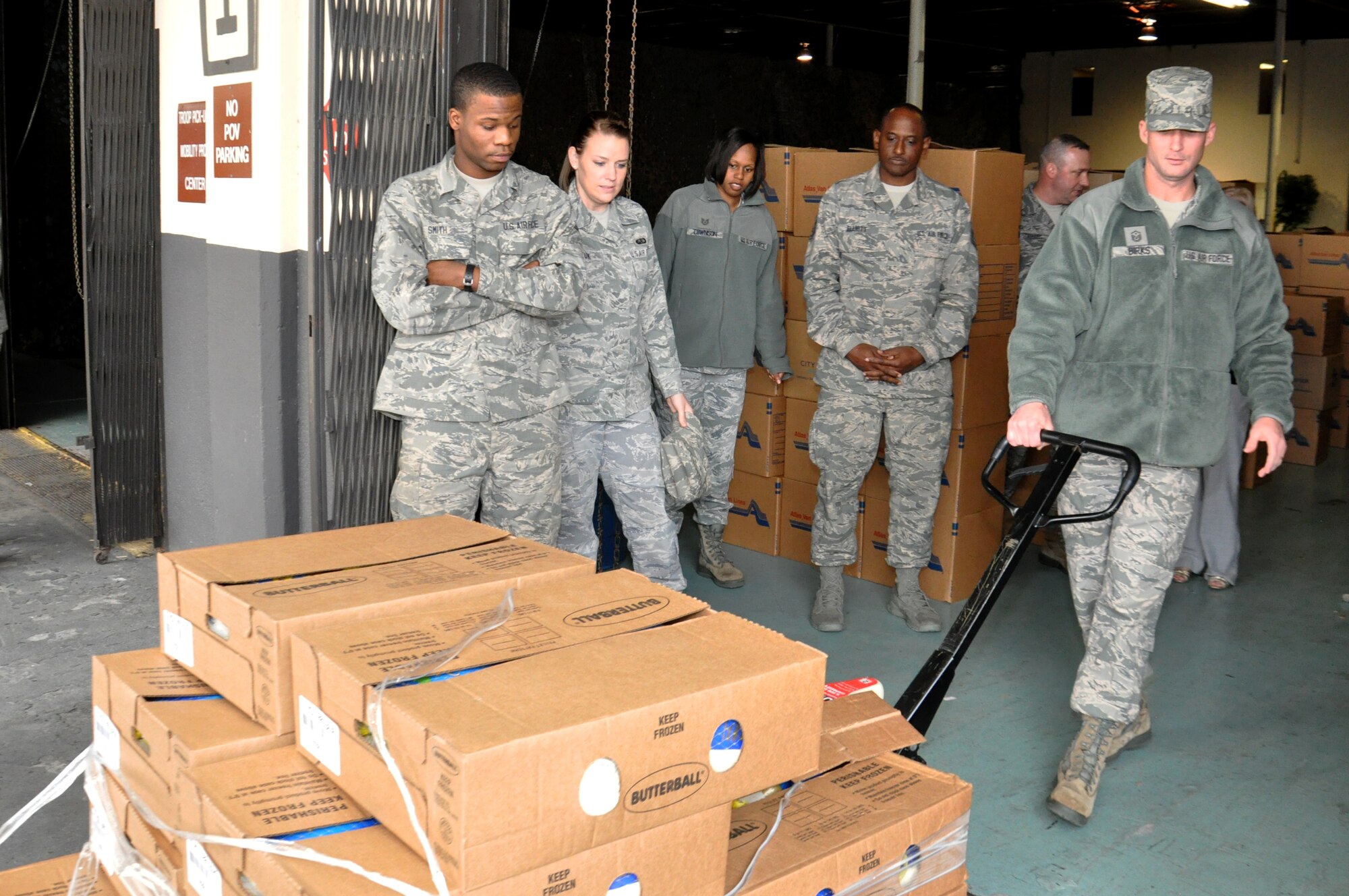 U.S. Air Force Master Sgt. Travis Birks, 911th Air Refueling Squadron first sergeant, pulls cases of frozen turkeys off of a truck on Seymour Johnson Air Force Base, N.C., Nov. 14, 2012. Butterball donated 252 frozen turkeys to the First Sergeant Council food basket drive that provides ready-to-prepare meals for Airmen and their families. (U.S. Air Force photo/Airman 1st Class Mariah Tolbert/Released)