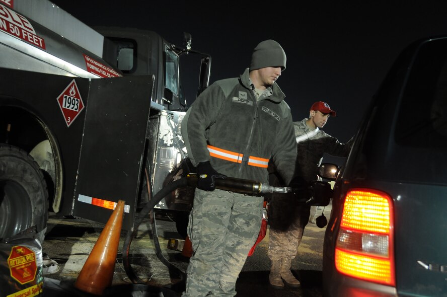 Airman 1st Class Brian Cooper, heavy equipment operator with the 201st Red Horse Squadron, fuels vehicles at Floyd Bennett Field, Brooklyn, N.Y. From Nov. 5 until Nov.13, members of the 201st RHS worked twelve-hour shifts with other National Guard units from seven states to distribute fuel to victims of Hurricane Sandy. (U.S. Air Force Photo by Tech. Sgt. Culeen Shaffer)