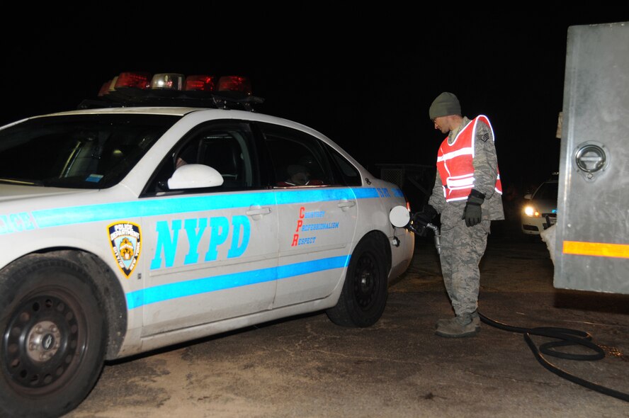 Staff Sgt. Jason Wieland, vehicle mechanic with the 171st Air Refueling Wing, fuels vehicles at Floyd Bennett Field, Brooklyn, N.Y. Members of the 171st ARW worked twelve-hour shifts with other National Guard units from seven states to distribute fuel to victims of Hurricane Sandy. (U.S. Air Force Photo by Tech. Sgt. Culeen Shaffer)