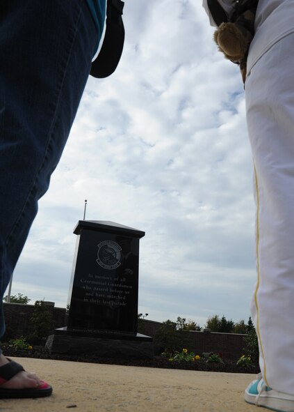 Airman 1st Class Michael Donovan, ceremonial guardsman, tells Bailey and Diana Reese about the monument to past Honor Guard members during a tour of the U.S. Air Force Honor Guard campus at Joint Base Anacostia-Bolling, D.C., Oct. 24, 2012.  (U.S. Air Force photo/Staff Sgt. Torey Griffith)