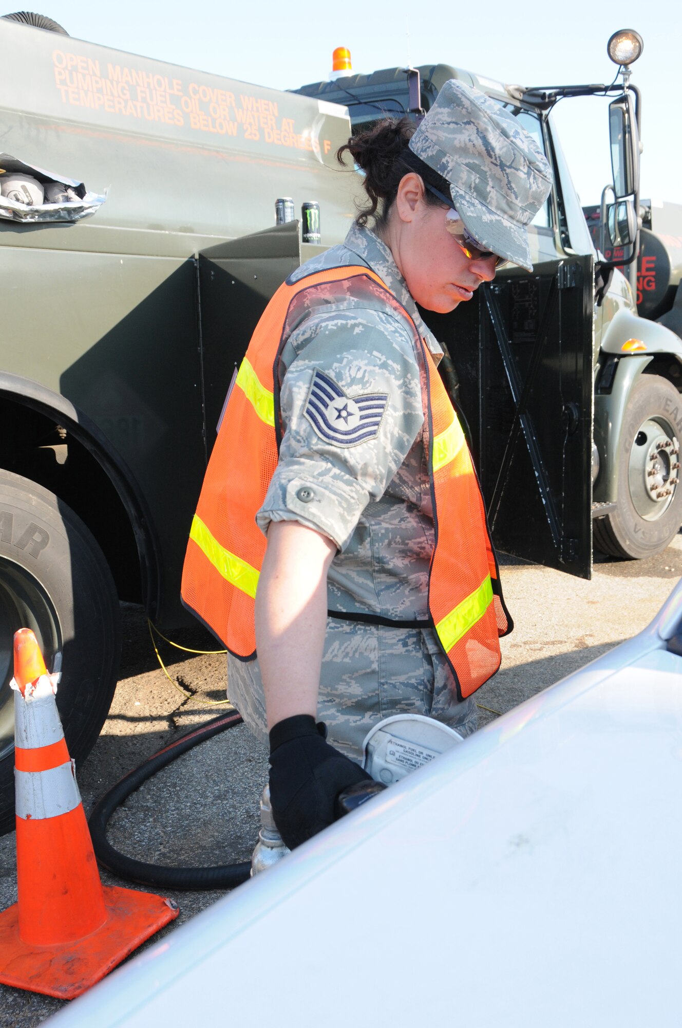 Tech. Sgt. Nicole Brennenman, fuels specialist with the 193rd Special Operations Wing, fuels vehicles at Floyd Bennett Field, Brooklyn, N.Y. From Nov. 5 until Nov.13, members of the 193rd SOW worked twelve-hour shifts with other National Guard units from seven states to distribute fuel to victims of Hurricane Sandy. (U.S. Air Force Photo by Tech. Sgt. Culeen Shaffer)
