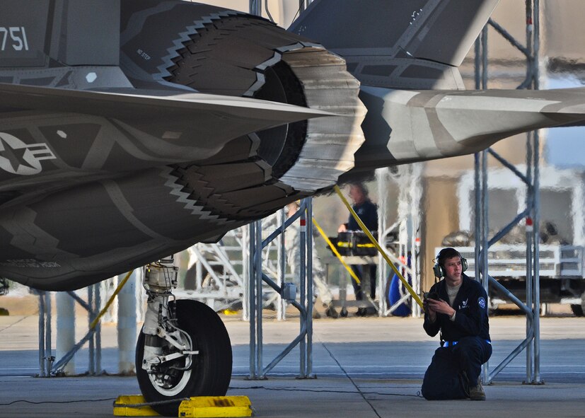 Staff Sgt. Travis Goll, a 58th Aircraft Maintenance Unit crew chief, begins communicating with the pilot of an F-35A Lightning II Nov. 14, 2012, at Eglin Air Force Base, Fla. The landing of the aircraft marked the last sortie to complete the 33rd Fighter Wing's flying and training portions of the Air Force Operational Utility Evaluation for the joint strike fighter. A Joint Operational Test Team will write its report of its evaluation here for Air Education and Training Command's review and approval, "Ready For Training," needed for the wing to begin formal F-35A training. (U.S. Air Force photo/Maj. Karen Roganov) 
