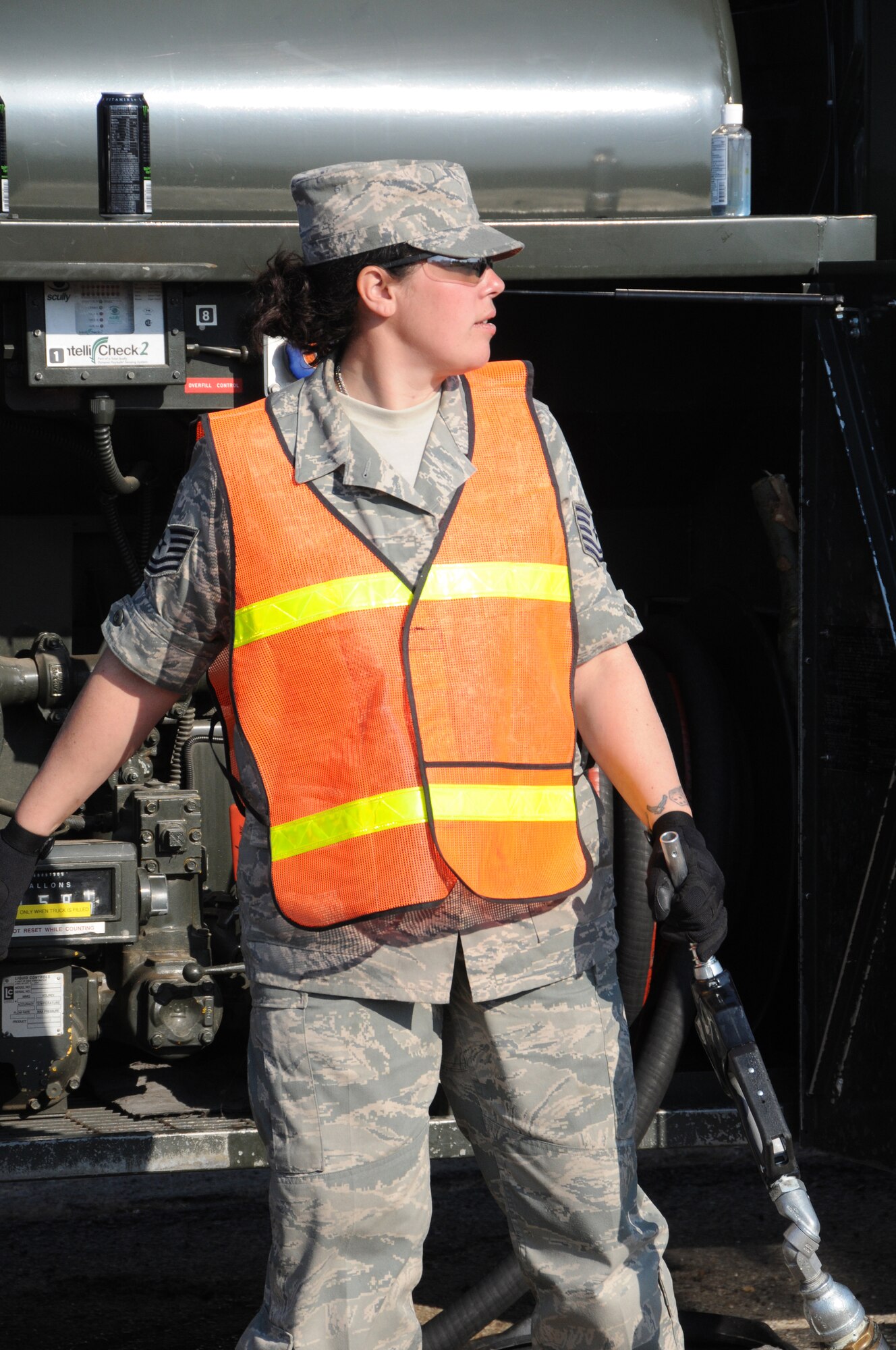 Tech. Sgt. Nicole Brennenman, fuels specialist with the 193rd Special Operations Wing, fuels vehicles at Floyd Bennett Field, Brooklyn, N.Y. From Nov. 5 until Nov.13, members of the 193rd SOW worked twelve-hour shifts with other National Guard units from seven states to distribute fuel to victims of Hurricane Sandy. (U.S. Air Force Photo by Tech. Sgt. Culeen Shaffer)