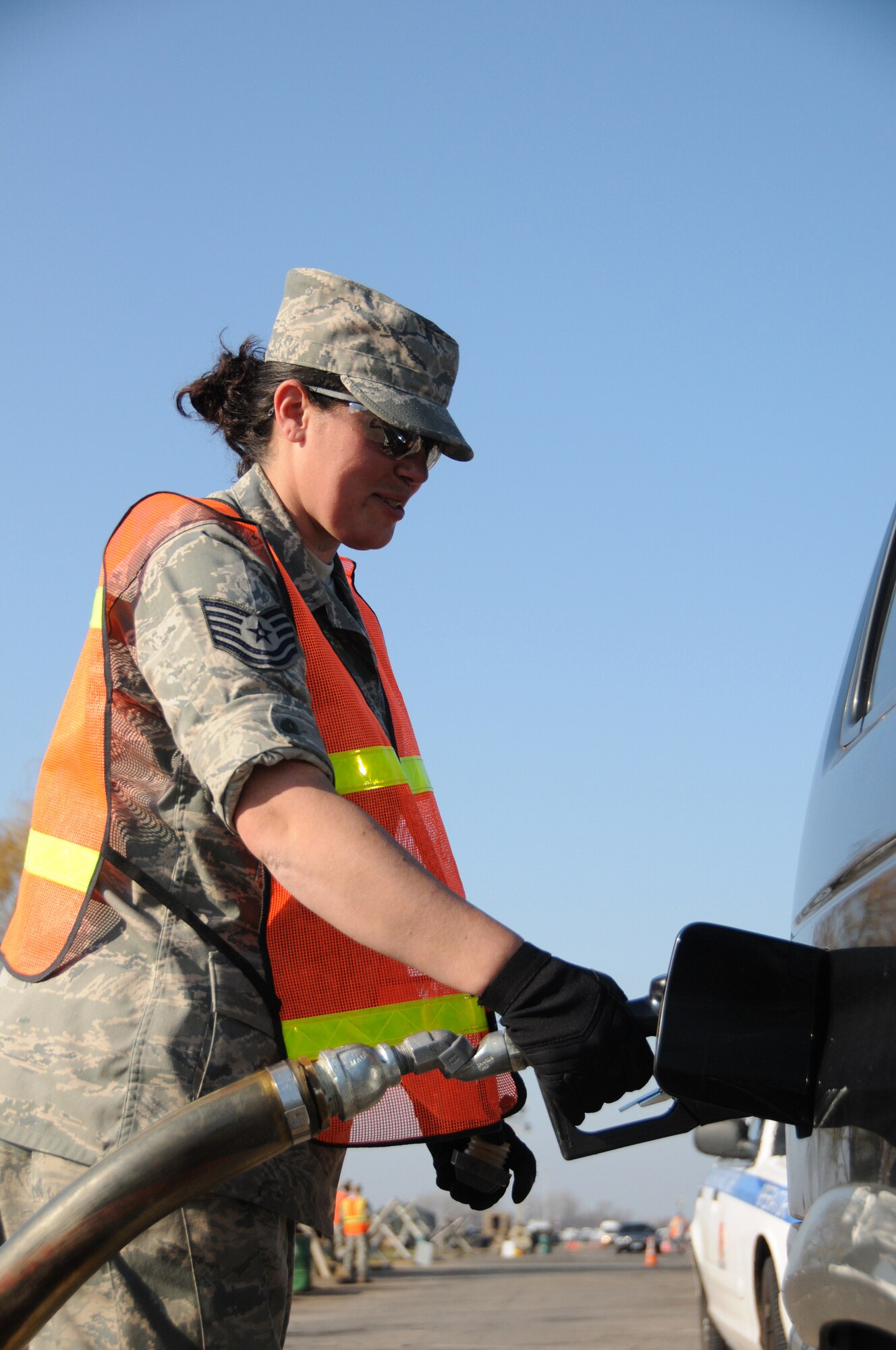 Tech. Sgt. Nicole Brennenman, fuels specialist with the 193rd Special Operations Wing, fuels vehicles at Floyd Bennett Field, Brooklyn, N.Y. From Nov. 5 until Nov.13, members of the 193rd SOW worked twelve-hour shifts with other National Guard units from seven states to distribute fuel to victims of Hurricane Sandy. (U.S. Air Force Photo by Tech. Sgt. Culeen Shaffer)