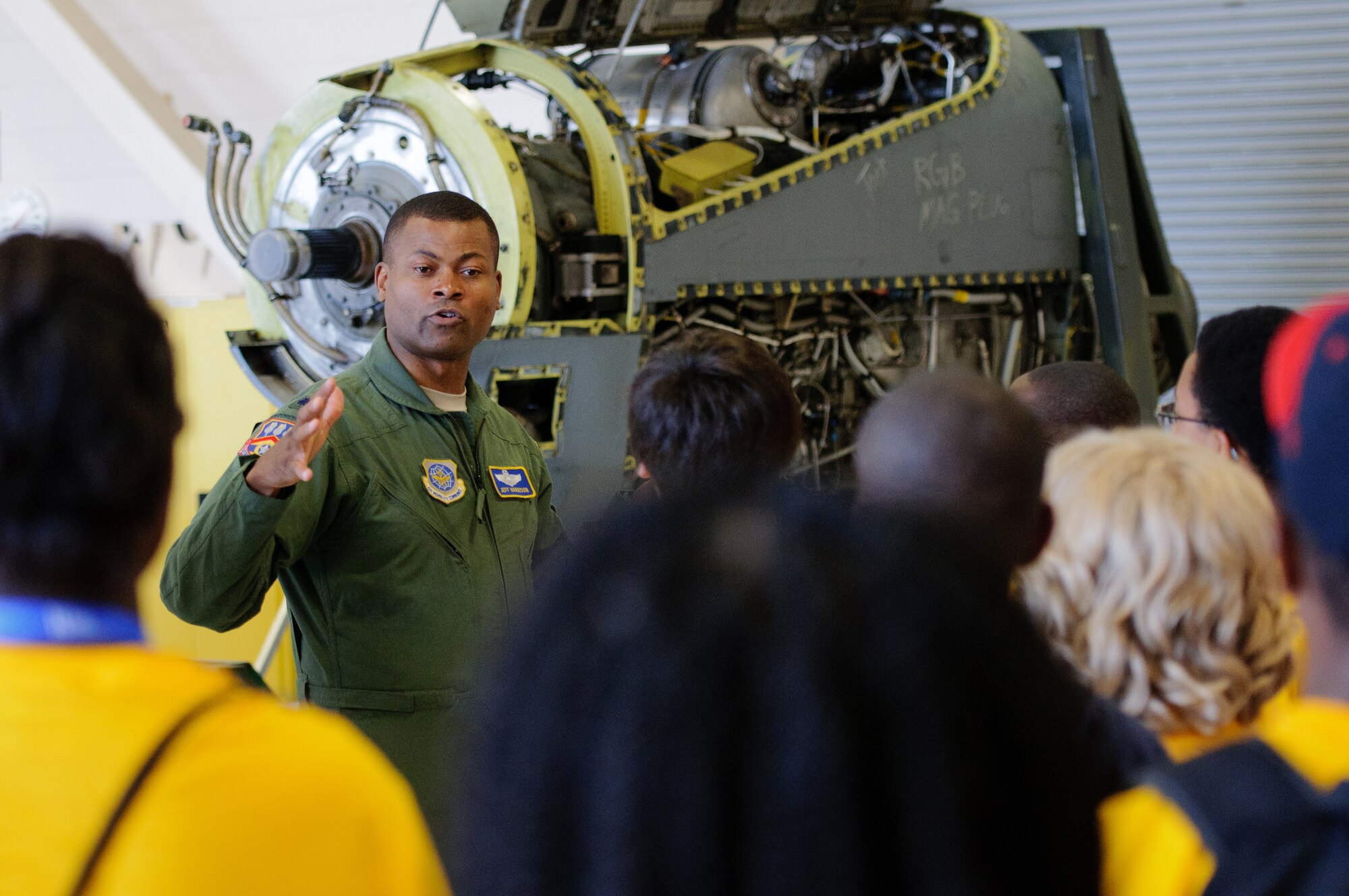 Lt. Col. Jeff Harrison, a Kentucky Air Guard C-130 pilot, discusses the operation of aircraft engines June 15, 2012, with middle and high school students attending the Organization of Black Aerospace Professionals Summer Aviation Career Education Academy at the Kentucky Air National Guard base in Louisville, Ky. The program’s mission is to stimulate youngsters’ interest in the aerospace community. (U.S. Air Force photo by Master Sgt. Phil Speck)