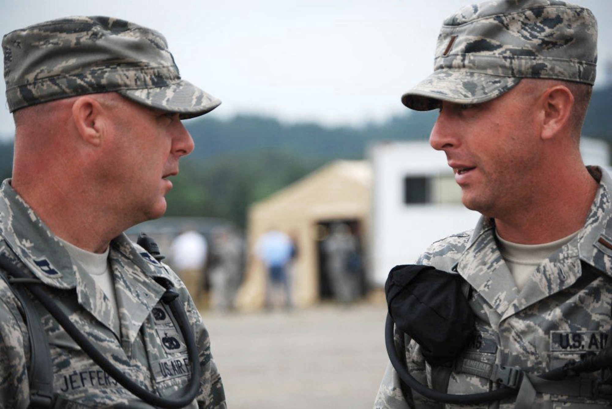 2nd Lt. Jonathan Fairbanks (right), 123rd Force Support Squadron Fatality Search and Recovery Team officer in charge, talks with Airzona FSRT officer in charge Capt. Paul W. Jefferson during Patriot 12 at Volk Field, Wis. July 15, 2012. (Courtesy photo)