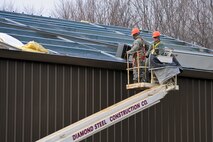 YOUNGSTOWN AIR RESERVE STATION, Ohio — U.S. Air Force Reserve skilled tradesmen with 910th Civil Engineers here, construct the roof of a new building Nov. 14, 2012 at the civil engineer training site here. The new training site will offer valuable training to civil engineer squadrons from several units, while adding usable training and exercise structures to YARS. Released/U.S. Air Force photo by Tech. Sgt. Brenda Cosola
