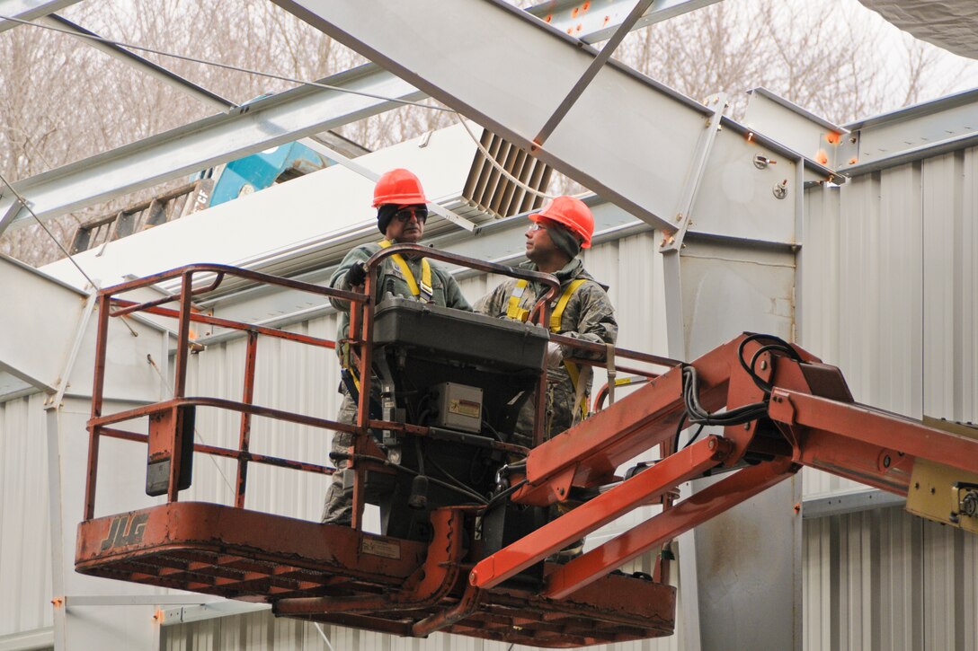 YOUNGSTOWN AIR RESERVE STATION, Ohio — U.S. Air Force Reserve Master Sgt. Robert D. Metts, skilled tradesman with 910th Civil Engineers here, positions an elevated work platform into place Nov. 14, 2012 at the civil engineer training site here. The new training site will offer valuable training to civil engineer squadrons from several units, while adding usable training and exercise structures to YARS. Released/U.S. Air Force photo by Tech. Sgt. Brenda Cosola