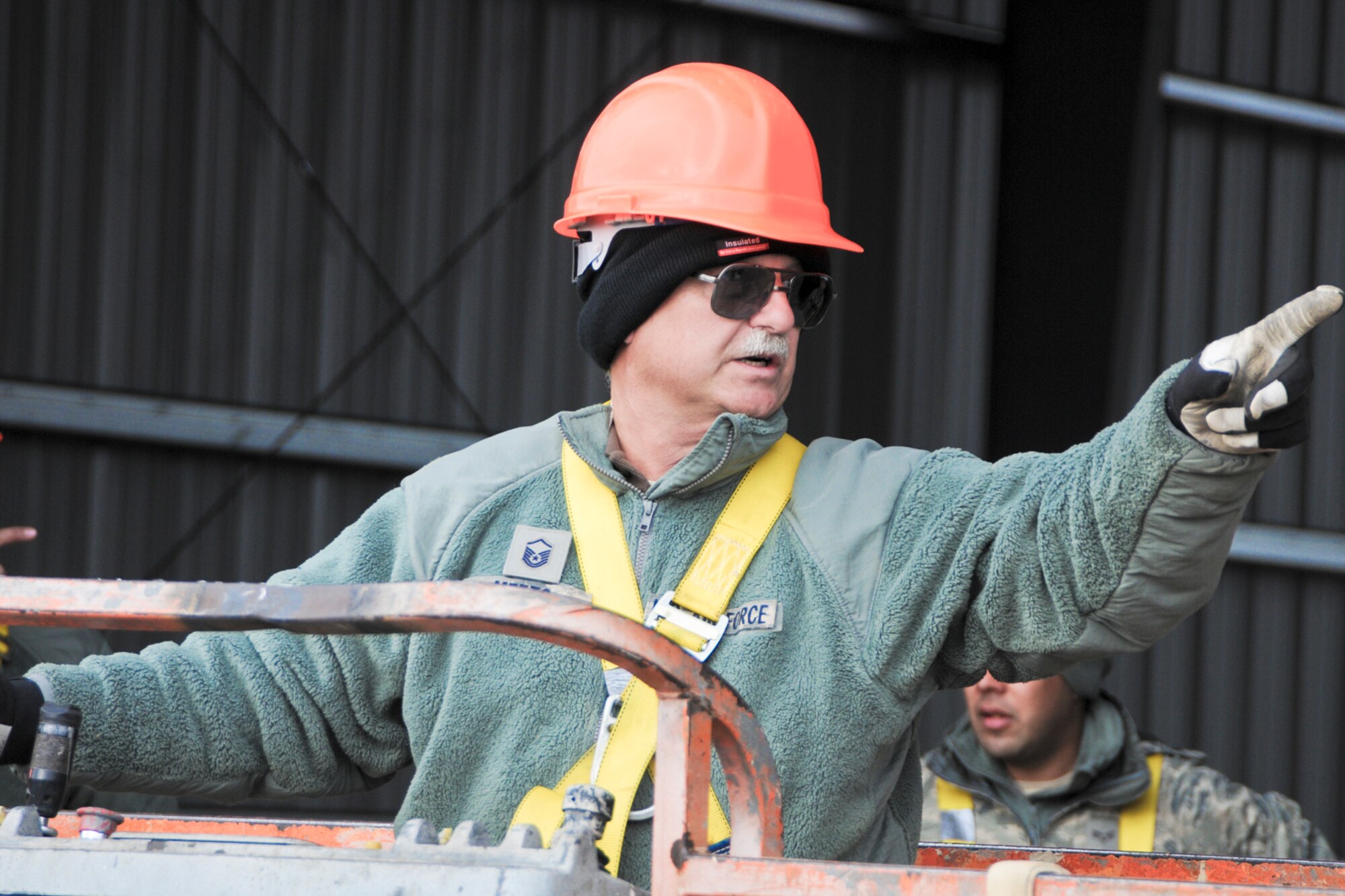 YOUNGSTOWN AIR RESERVE STATION, Ohio — U.S. Air Force Reserve Master Sgt. Robert D. Metts, skilled tradesman with 910th Civil Engineers here, gives directions his co-workers Nov. 14, 2012 before he begins work at the civil engineer training site here. The new training site will offer valuable training to civil engineer squadrons from several units, while adding usable training and exercise structures to YARS. Released/U.S. Air Force photo by Tech. Sgt. Brenda Cosola