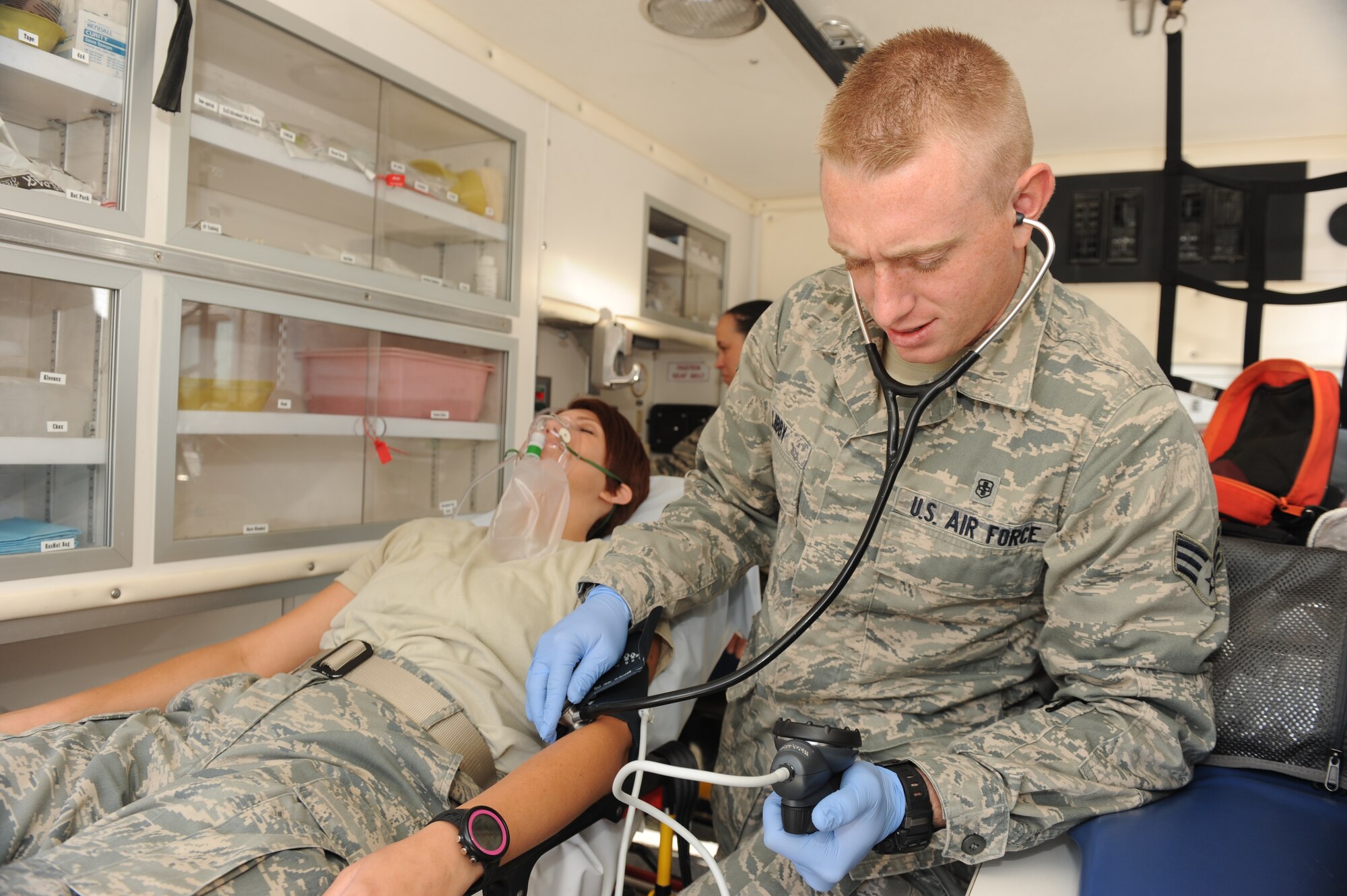 SOUTHWEST ASIA – Senior Airman Keith Libby (right), 379th Expeditionary Medical Group combat medical technician, reads the blood pressure of Staff Sgt. Danielle Diaz, 379th EMDG combat medical technician, during a training exercise Nov. 14, 2012. All Air Force combat medics are certified to be emergency medical technicians. The medics are required to know all operations inside an ambulance and how to properly take care of the patient while in the ambulance as EMTs. Libby is deployed from Joint Base Langley-Eustis, Va., and is a native of Apple Valley, Calif. Diaz is deployed from Joint Base Langley-Eustis, Va., and is a native of Minot, N.D. (U.S. Air Force photo/Senior Airman Joel Mease)