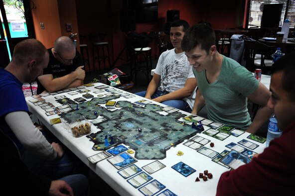 Senior Airman Jason Rimer, 39th Contracting Squadron contract specialist, top right, plays a "big box" game with five others during the 18th session of Incirlik Table Top Warriors Nov. 10, 2012, at Incirlik Air Base, Turkey. Big box games can take up to eight or even 10 hours and involve a larger number of players. (U.S. Air Force photo by Senior Airman Anthony Sanchelli/Released)