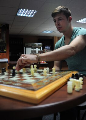 Senior Airman Jason Rimer, 39th Contracting Squadron contract specialist, plays a game of chess during the 18th session of Incirlik Table Top Warriors Nov. 10, 2012, at Incirlik Air Base, Turkey. Rimer started ITTW in April, and since then the gaming group has gained 37 members total. (U.S. Air Force photo by Senior Airman Anthony Sanchelli/Released)