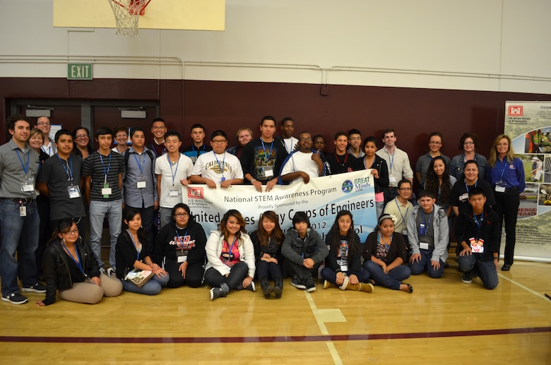 Volunteers from the U.S. Army Corps of Engineers Sacramento District pose with students at Hiram W. Johnson High School in Sacramento, Calif., for a photograph during a science, technology, engineering and mathematics - or STEM - event Nov. 9, 2012. Hosted by the Sacramento District, the STEM event provided an opportunity for the students to learn more about degrees and careers in STEM-related fields. 