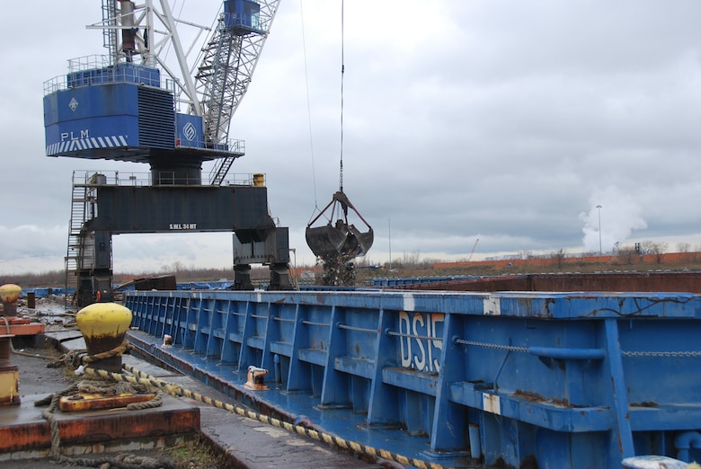 Debris from Hurricane Sandy is loaded onto barges at a temporary collection point on New York’s Staten Island. U.S. Army Corps of Engineers staffers from across the nation are assisting with recovery efforts following the storm.
