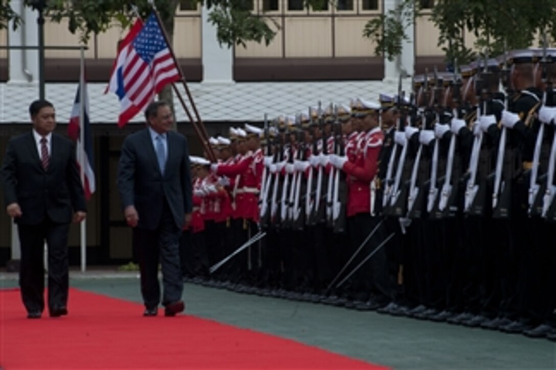 Thailand's Minister of Defence Sukampol Suwannathat, left, escorts Secretary of Defense Leon E. Panetta as he inspects the honor guard in Bangkok, Thailand, on Nov. 15, 2012.  Sukampol and Panetta will meet to discuss regional security items of interest to both nations and to affirm U.S.-Thailand security ties.  