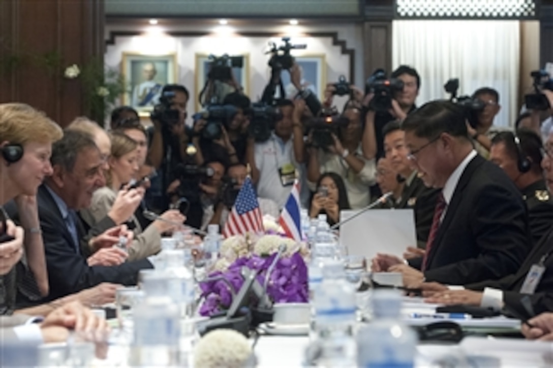 Secretary of Defense Leon E. Panetta, second from left, and Thailand's Minister of Defence Sukampol Suwannathat, right, begin their meeting with extensive press coverage in Bangkok, Thailand, on Nov. 15, 2012.  Panetta and Sukampol are meeting to discuss regional security items of interest to both nations and to affirm U.S.-Thailand security ties.  