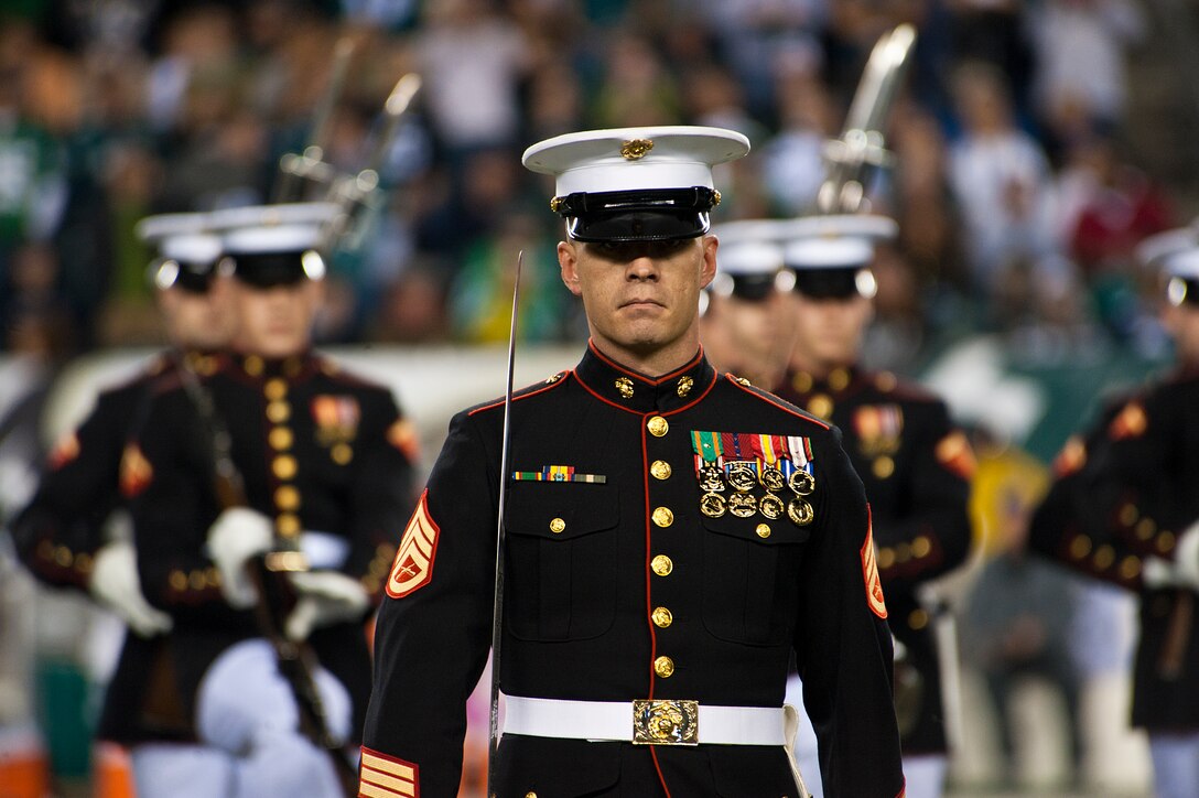 Staff Sgt. Scott Wilkie, Silent Drill Platoon platoon sergeant, leads his platoon onto the Philadelphia Eagle's Lincoln Financial Field to perform for halftime Nov. 11. The 24-Marine platoon performed for tens of thousands of spectators this Veteran's Day to the chanting of "U.S.A! U.S.A!" (Official Marine Corps photo by Sgt. Austin Hazard/released)