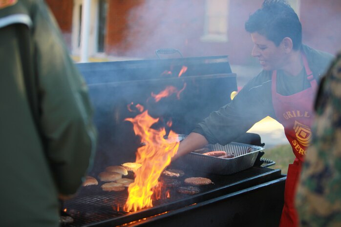 First Sgt. Brenda R. Chrismer, the first sergeant of Headquarters Company, Combat Logistics Regiment 27, 2nd Marine Logistics Group, grills hamburgers and hotdogs at the conclusion of the company’s fall training aboard Camp Lejenue, N.C., Nov. 5, 2012. The company conducted the training to improve awareness on issues such as sexual assault, suicide, cold-weather injuries and drug abuse.