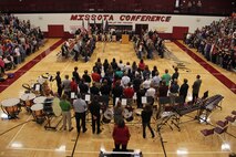The New Prague High School student body stands for the arrival of the honor guard during the school's Veterans Day ceremony on Nov. 12. Burnsville, Minn., recruiter Sgt. Richard Dibiaso, 32, from Aurora, Ill., addressed the audience during the ceremony.