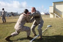 Chief Warrant Officer Rilin P. Desamours and Maj. Robert B. Thomas, right, practice a Marine Corps Martial Arts Program technique during a martial arts instructor course at Camp Kinser Oct. 23. Marines with the Martial Arts Center of Excellence, located at Marine Corps Base Quantico, Va., flew to Okinawa and observed the course and provided some lessons and feedback. Desamours is a tactical communications planning and engineering officer with Headquarters Company, Headquarters Battalion, 3rd Marine Division, III Marine Expeditionary Force. Thomas is the operations officer for Combat Logistics Regiment 37, 3rd Marine Logistics Group, III MEF. 