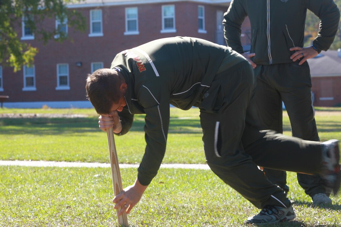 A Marine with Headquarters Company, Combat Logistics Regiment 27, 2nd Marine Logistics Group executes the “dizzy izzy” during a team-building competition during the company’s fall training session aboard Camp Lejeune, N.C., Nov. 5, 2012. Headquarters Co. added physical activity to its classes in an effort to make them more engaging for the Marines and sailors.