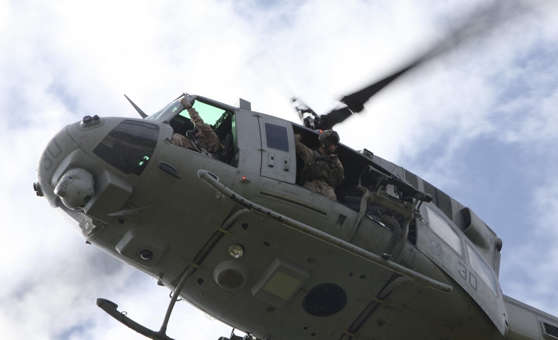 Marines with VMM-266 provide air support to a Security Force Assistance Adviser Team during a unmounted foot patrol at at Marine Corps Auxiliary Landing Field Bogue Oct. 18. The air support allowed the SFAAT to practice real-world scenarios that they may encounter while deployed in Afghanistan.
