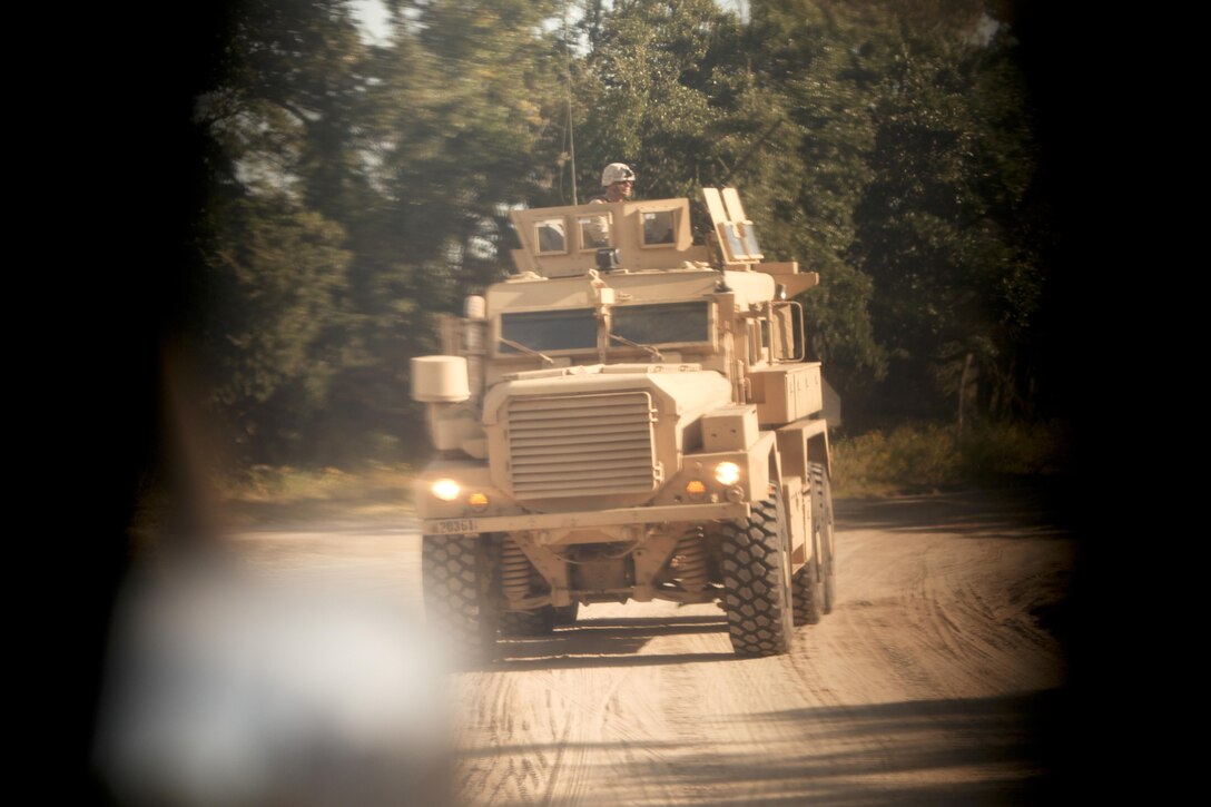 Marines with II Marine Expeditionary Force (Forward) Marines conducted mounted convoy operations at Marine Corps Auxiliary Landing Field Bogue Oct. 18. The weeklong exercise tested the Marines ability to detect improvised explosive devices (IEDs) in an interactive environment.