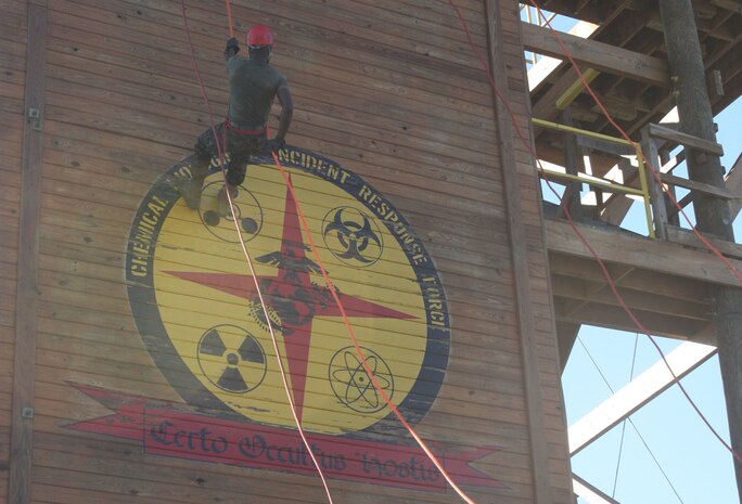 A Marine assigned to the Chemical Biological Incident Response Force descends the rappel tower at the Downey Responder Training Facility aboard Naval Annex Stump Neck during the second phase of the Commander’s Challenge on Nov. 6.