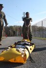 Cpl. Kathyria Ayala, a supply Marine with the Chemical Biological Incident Response Force, pulls a casualty sled down the 100 meter stretch during the third and final phase of the Commander’s Challenge on Nov. 6.