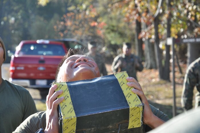 Captain Andrew Liu contributes his part to the 600 ammo can lift during the first phase of the Chemical Biological Incident Response Force Commander’s Challenge on Nov. 6. 