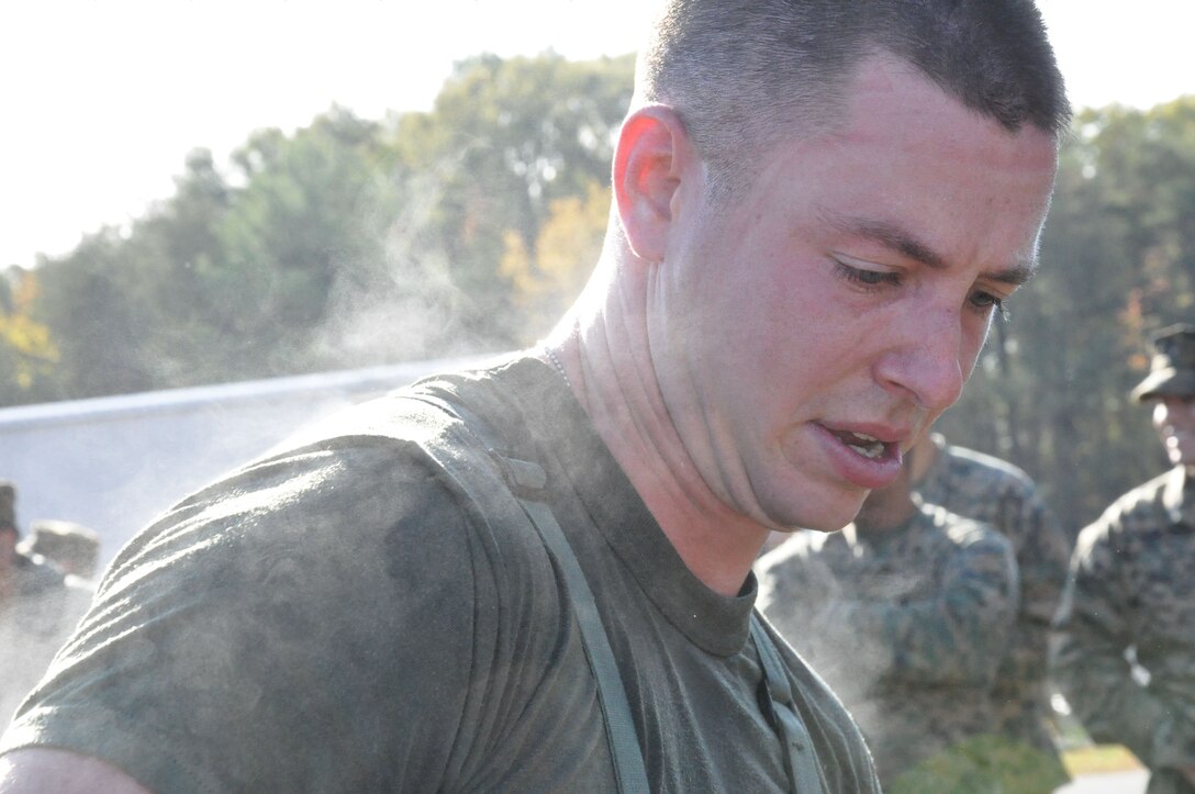 Steam rolls off Sgt. Michael Gannon, an Extract Marine assigned to React Company with the Chemical Biological Incident Response Force, after he completed a three-mile run in protective MOPP gear and a gas mask during the second phase of the CBIRF Commander’s Challenge on Nov. 6. 