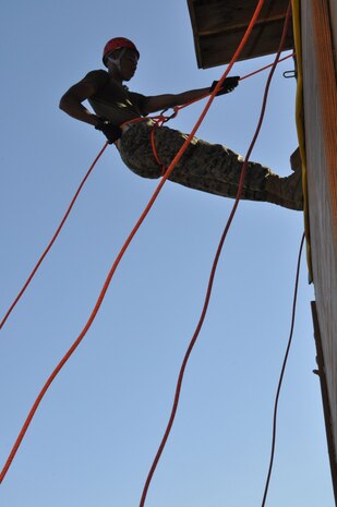 A Marine assigned to the Chemical Biological Incident Response Force prepares to descend the rappel tower at the Downey Responder Training Facility at Naval Annex Stump Neck during the second phase of the Commander’s Challenge on Nov. 6.