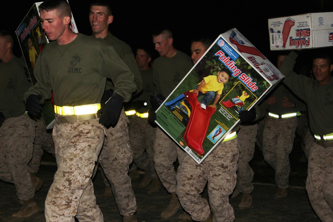 Fort Leonard Wood Marines run with toys they donated to help supports Toys For Tots program. 