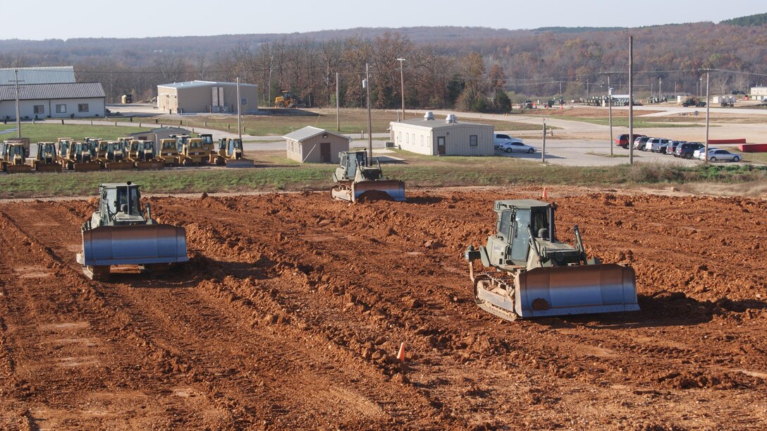 Marines attending the Basic Engineer Equipment Operators Course perform practical application utilizing the Medium Crawler Tractor 850JR.