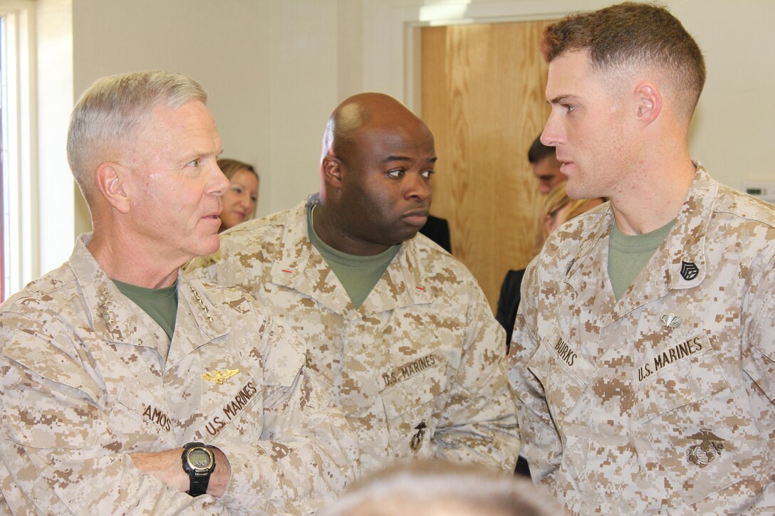The 35th Commandant of the Marine Corps, General James F. Amos, Chief Warrant Officer Five Domah W. Diggs and Staff Sergeant Matthew W. Burks discuss the Chemical Biological Radiological and Nuclear (CBRN) School's mission while observing students learn to conduct CBRN hazard prediction at Fort Leonard Wood Missouri on October 18, 2012. 