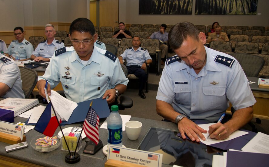 Maj. Gen. Raul Dimatatac, vice commander, Philippine Air Force (left), and Lt. Gen. Stanley Kresge, vice commander, Pacific Air Forces, sign Terms of Reference agreements between their two air forces at the conclusion of the first United States and Philippine Airman-to-Airman Talks here at Joint Base Pearl Harbor-Hickam.  During Philippine President Benigno Aquino III’s visit to Washington, D.C. in June, 2012, U.S. President Barack Obama reaffirmed the United States’ commitment to the long-standing mutual defense treaty between the two nations. (U.S. Air Force photo/Staff Sgt. Matthew S. Bright)