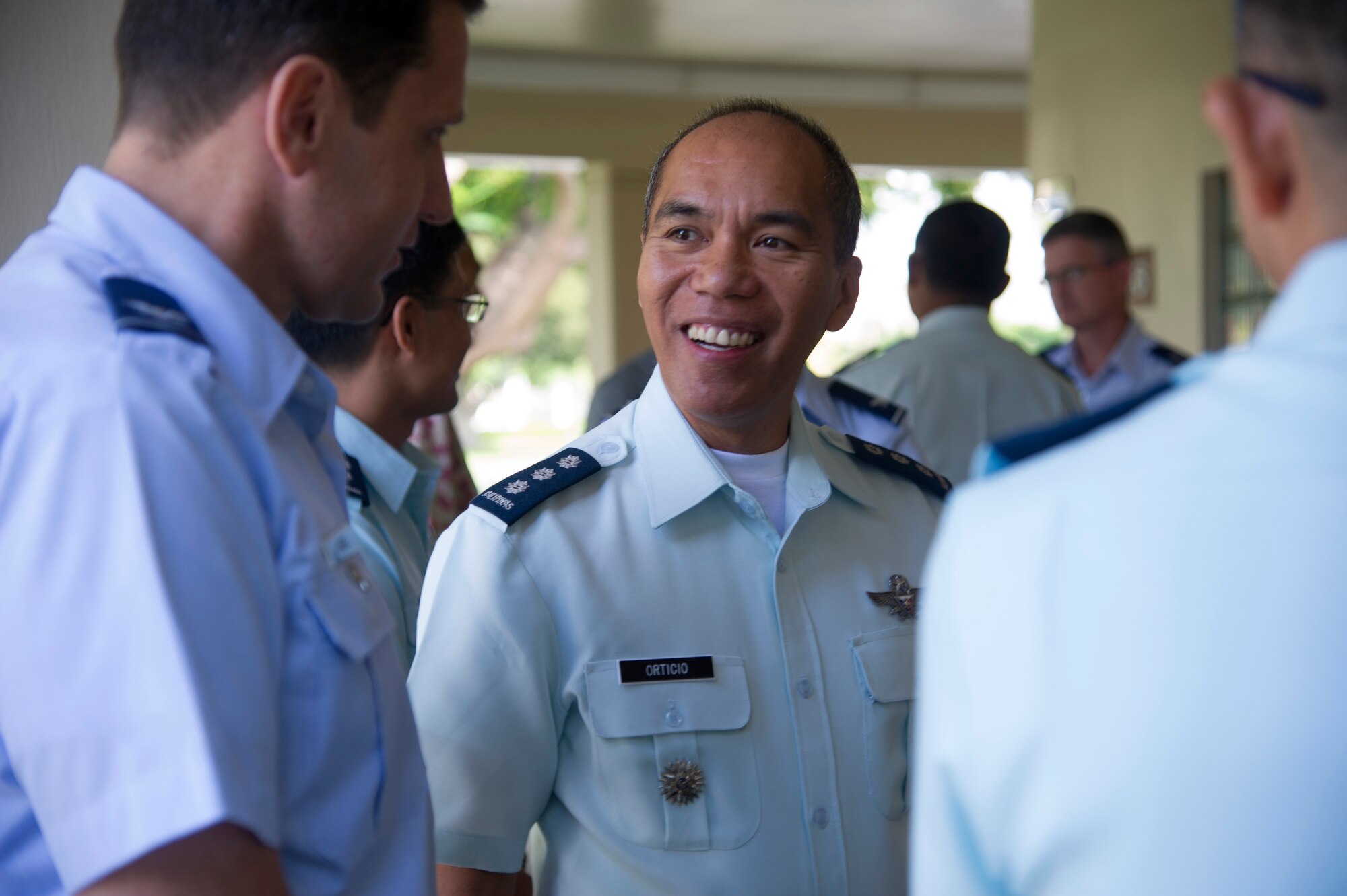 During a break, Col. Arturo Orticio, Philippine Air Force deputy wing commander, Air Defense Wing, socializes with Pacific Air Forces airmen at the first United States and Philippine Airman-to-Airman Talks here at Joint Base Pearl Harbor-Hickam.  Secretary of State Hillary Rodham Clinton’s visit to the Republic of the Philippines in November, 2011, demonstrated the critical importance placed on the U.S.-Philippine relationship and reinforced President Obama’s strategic rebalance toward the Pacific, a major theme of the Airman-to-Airman Talks.  (U.S. Air Force photo/Staff Sgt. Matthew S. Bright)