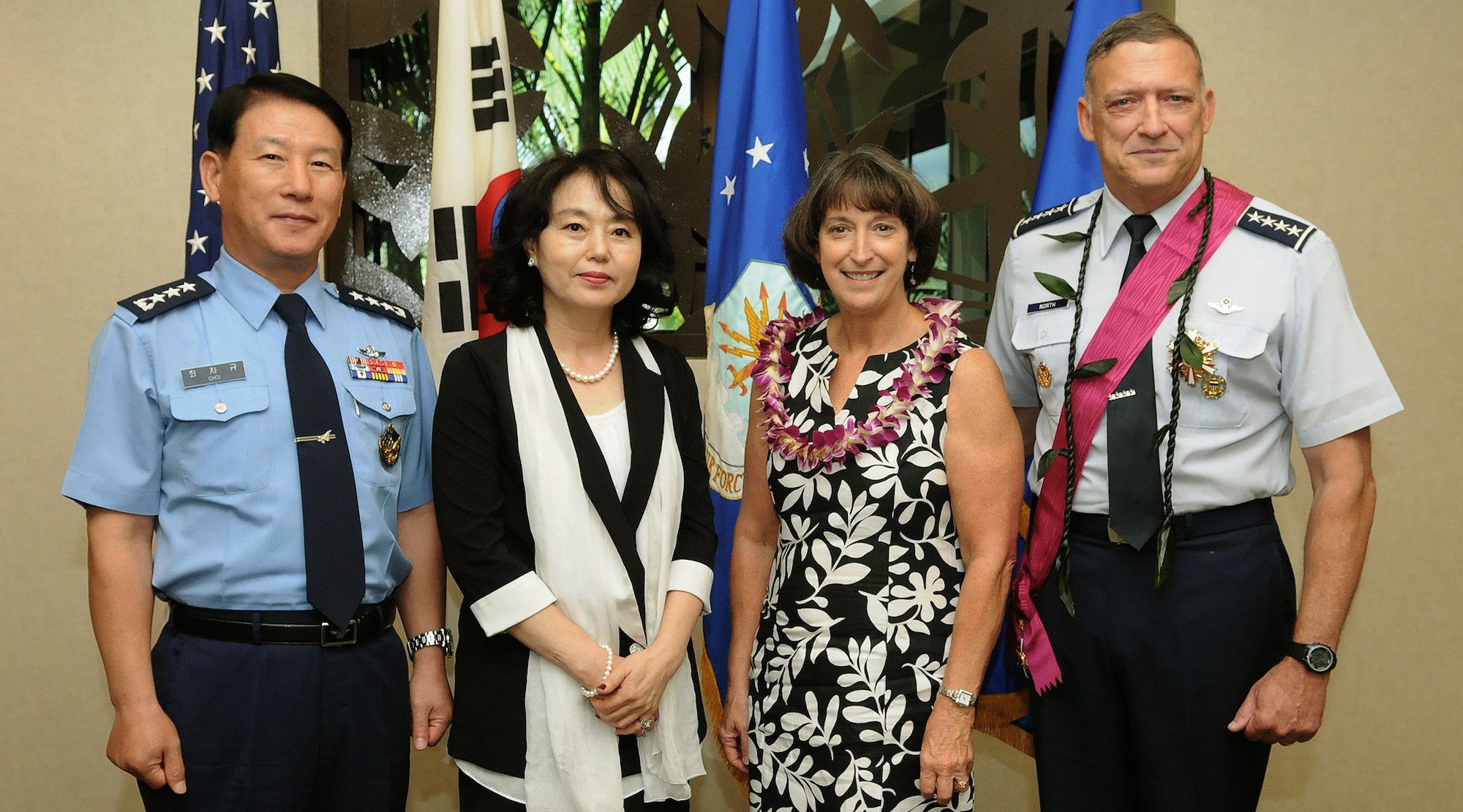 Lt. Gen. Cha-Kyu Choi, Republic of Korea, Air Force Vice Chief of Staff and his spouse Mrs. Jae Oak Yoon (left), join retired Gen. Gary North,  former Pacific Air Forces commander, and his spouse Mrs. Shelly North (right), for a group photo at the DePonte Suite, Headquarters PACAF, Joint Base Pearl Harbor-Hickam, Hawaii, Nov. 9, 2012. North’s was presented South Korea’s top medal for his role in promoting the alliance between the two nations. (U.S. Air Force photo/David Underwood/Released)